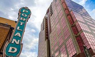 vertical blue Portland sign from below
